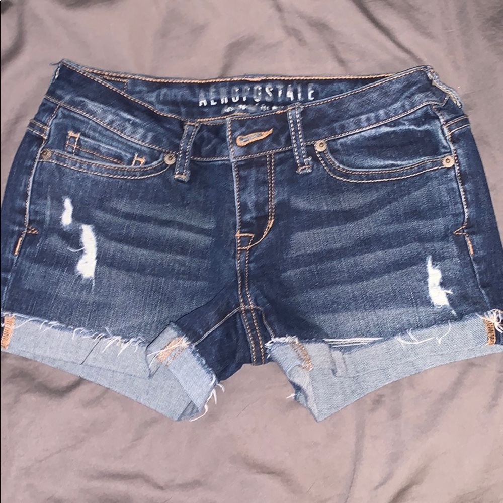Medium wash jean shorts.